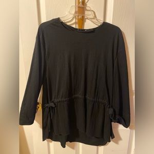 Black cotton long sleeve top.